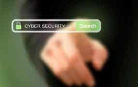 Businessman pressing cybersecurity search button on a virtual screen